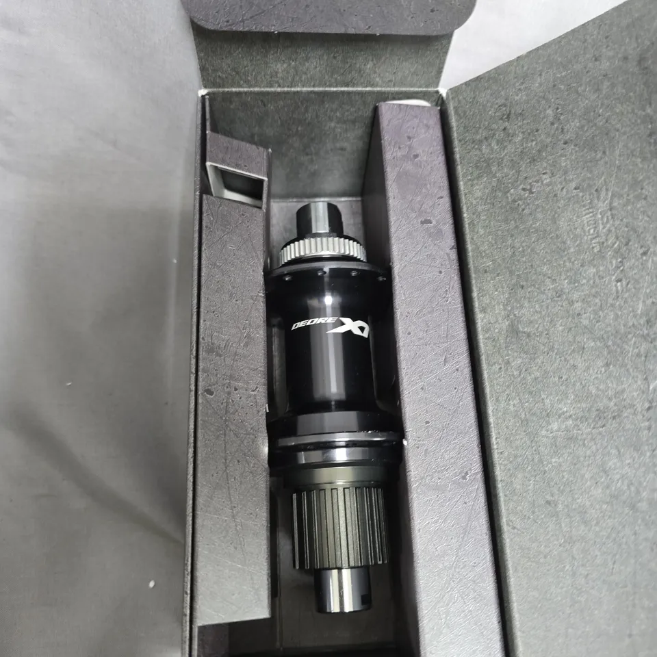 SHIMANO DEORE DX BICYCLE HUB COMPONENT – BOXED, BLACK CYLINDRICAL PART