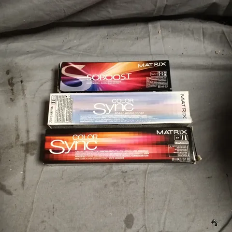 BOX OF APPROXIMATELY 68 HAIR CARE PRODUCTS INCLUDING MATRIX SOBOOST AND MATRIX COLOR SYNC BRUNETTE YELLOW MAGENTA PURPLE