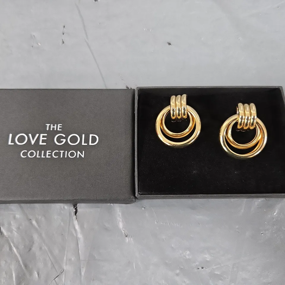 THE LOVE GOLD PLATED STATEMENT DROP HOOP EARRINGS 