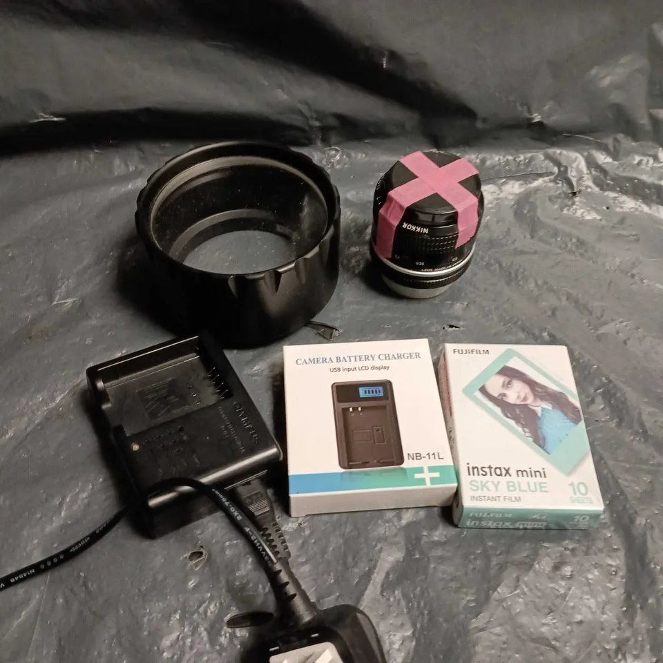 APPROXIMATELY 10 ASSORTED CAMERA ACCESSORIES TO INCLUDE LENS, BATTERY CHARGER, INSTANT FILM ETC 
