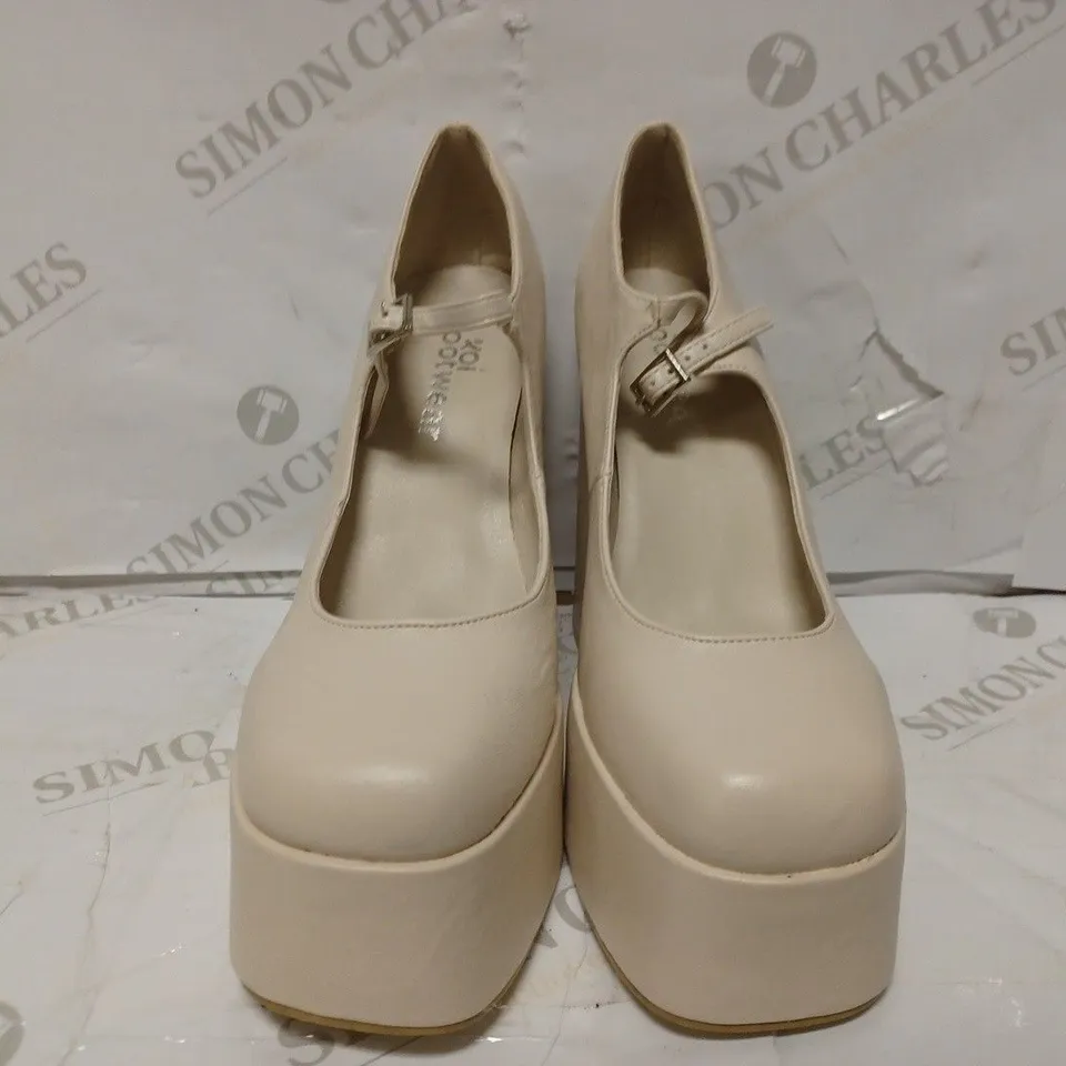 PAIR OF KOI DESIGNER VEGAN STRAP-UP PLATFORM HEELS IN CREAM - SIZE 6