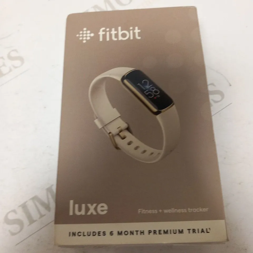 BOXED AND SEALED FITBIT LUXE FITNESS AND WELLNESS TRACKER