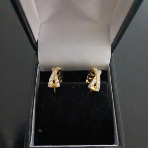 DIAMONIQUE CROSS OVER HUGGIE GOLD PLATED EARRINGS