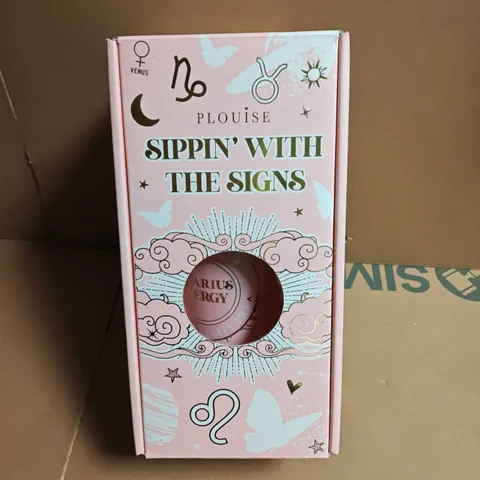 PLOUISE SIPPIN WITH THE SIGNS TRAVEL CUP