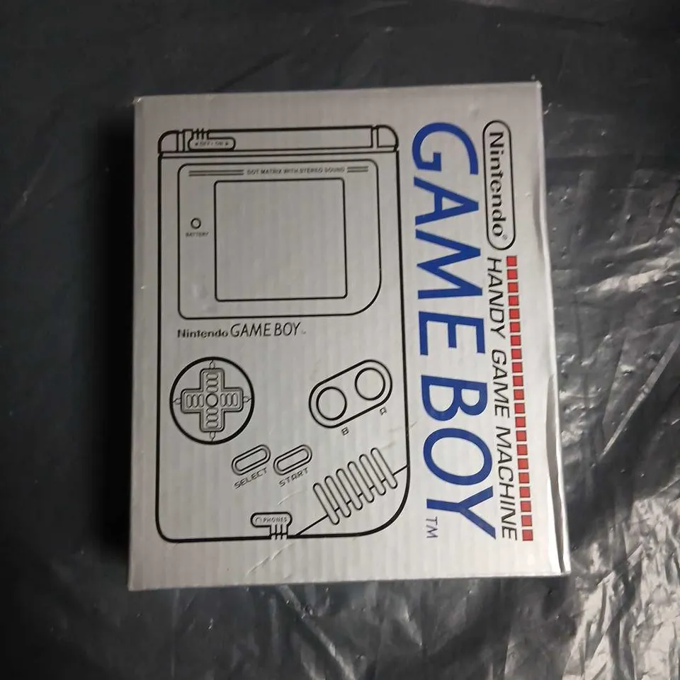 NINTENDO GAME BOY HANDHELD CONSOLE WITH MULTIPLE CARTRIDGES AND ORIGINAL BOX