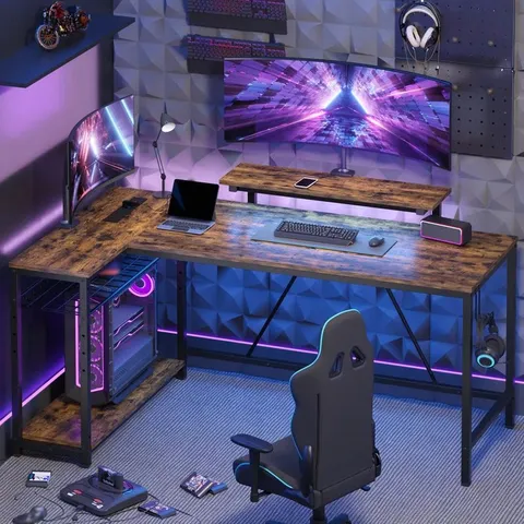 BOXED BAFORD L-SHAPED COMPUTER DESK WITH POWER OUTLET, GAMING DESK WITH MONITOR STAND AND SHELVES - RUSTIC (1 BOX)
