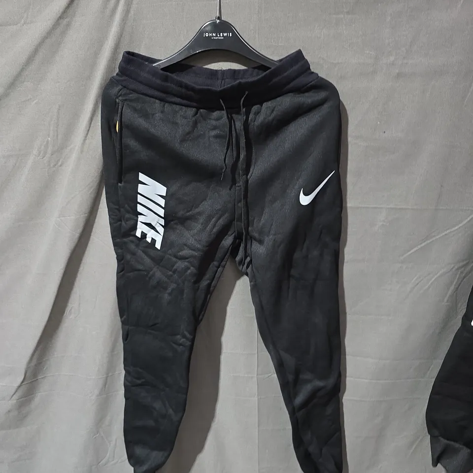 NIKE BLACK HOODIE WITH NEON ACCENTS AND 'JUST DO IT' POCKET GRAPHIC – UK SMALL (S)