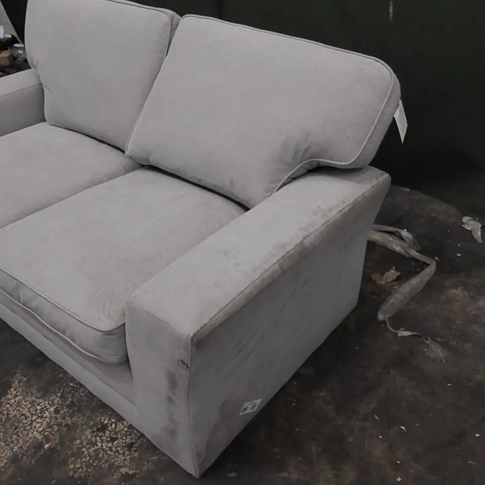 DESIGNER 2 SEATER UPHOLSTERED IN LIGHT COLOURED FABRIC 