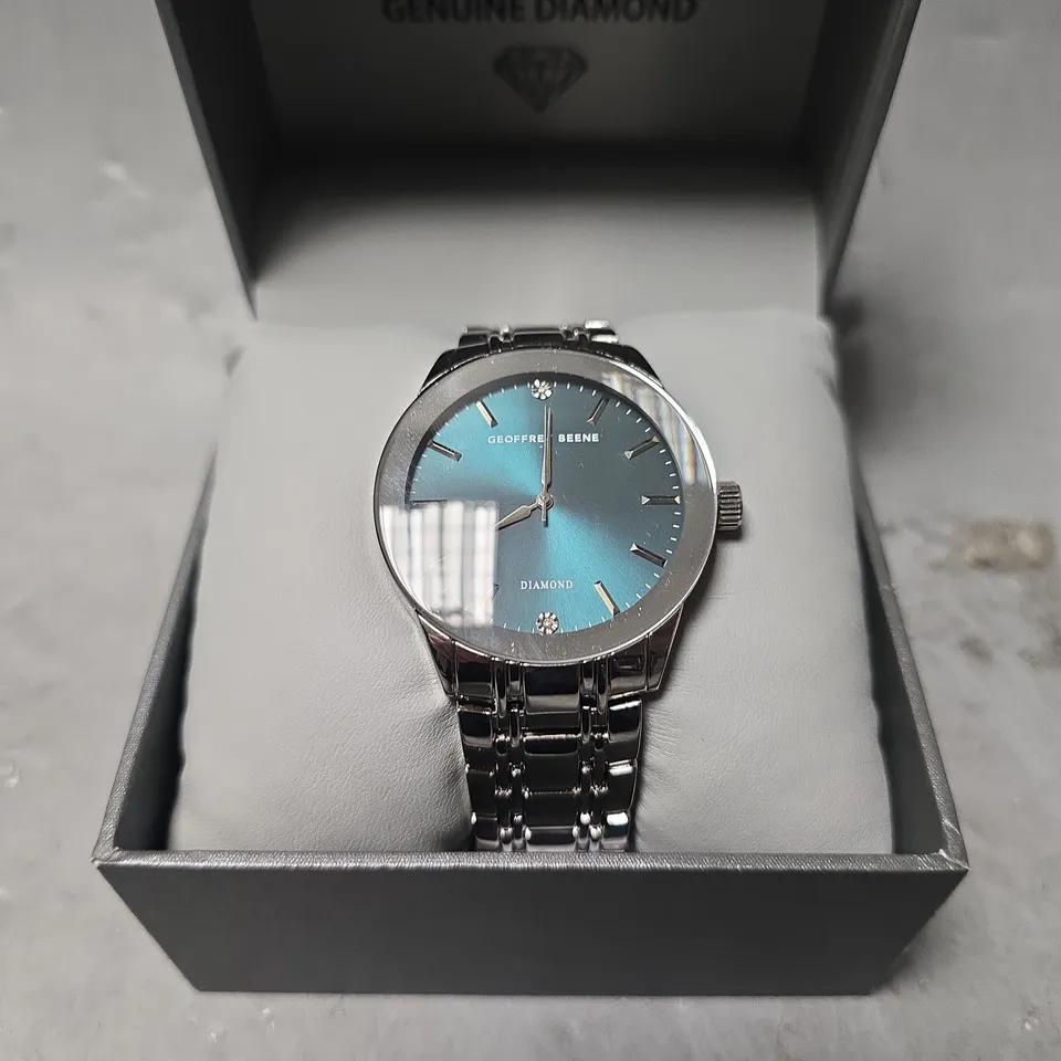 BOXED GEOFFERY BEENE TEAL DIAL CLASSIC WATCH 