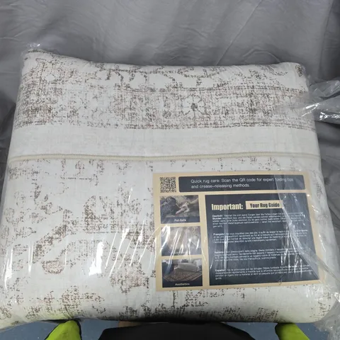 Beige & Cream Distressed Rug in Plastic Packaging