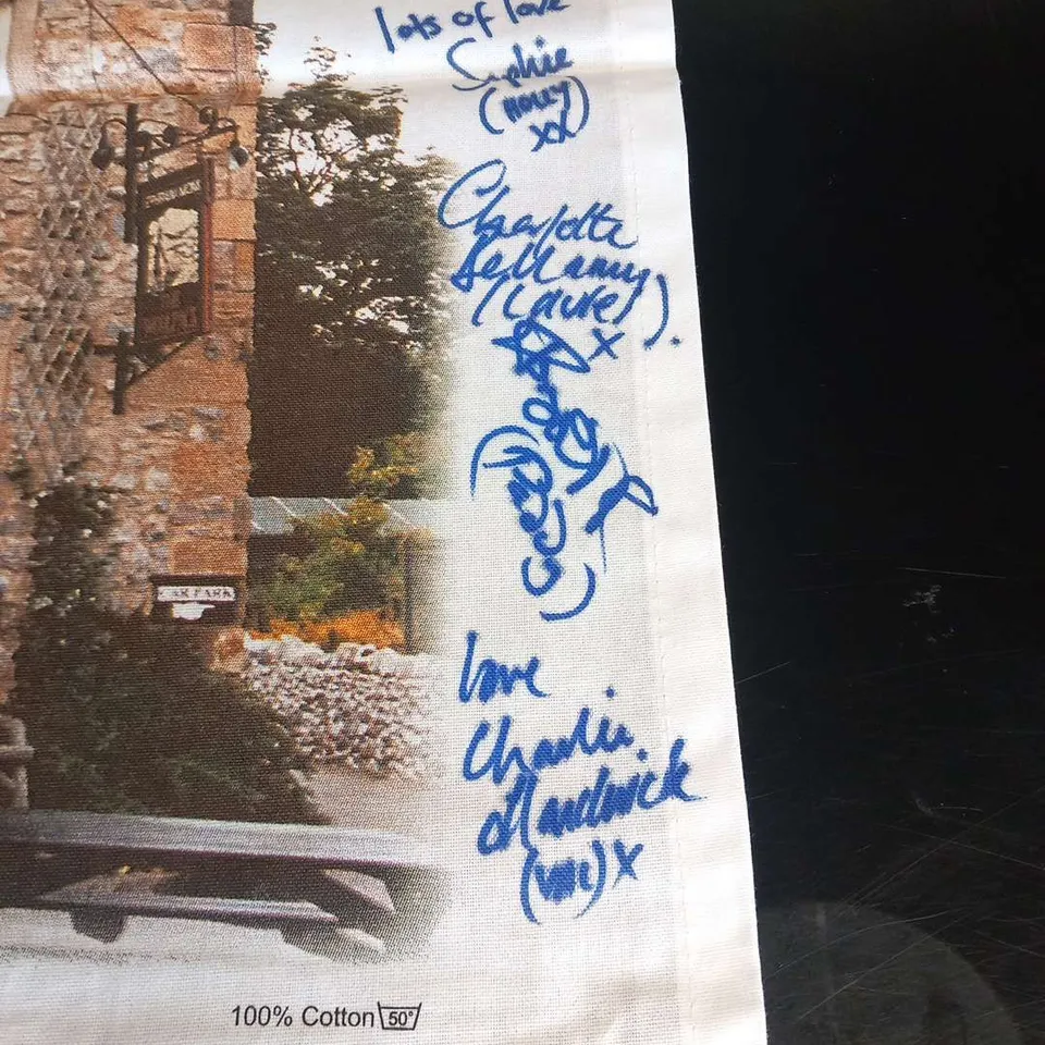 EMMERDALE'THE WOOLPACK' TEA TOWEL SIGNED BY THE CAST