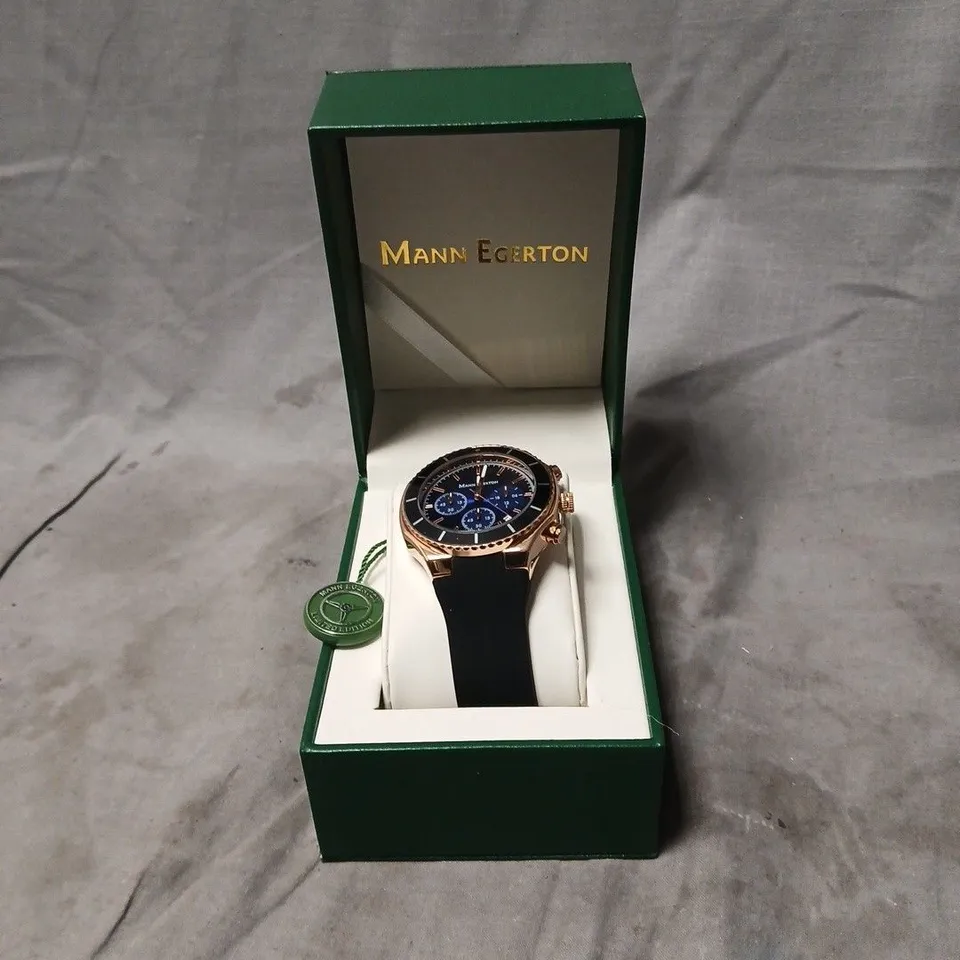 MANN EGERTON CHRONOGRAPH WATCH – ROSE GOLD TONE CASE, BLUE DIAL, BLACK RUBBER STRAP (BOXED)