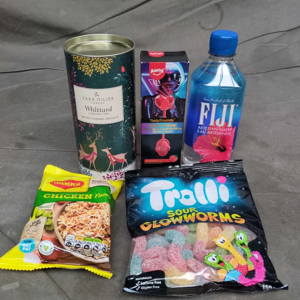 APPROXIMATELY 10 ASSORTED FOOD AND DRINK ITEMS TO INCLUDE MAGGI CHICKEN NOODLES, FIJI ARTESIAN WATER, TROLLI SOUR SWEETS, ETC