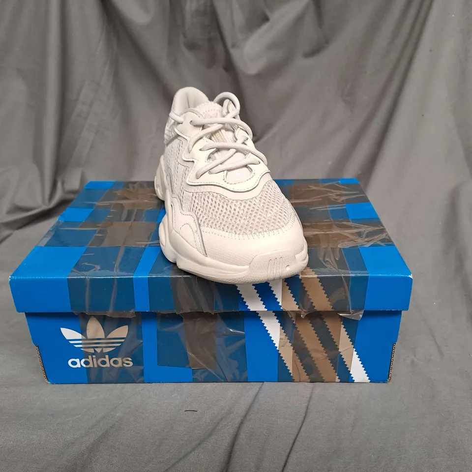 BOXED PAIR OF ADIDAS OZWEEGO TRAINERS IN VINTAGE WHITE SIZE 2