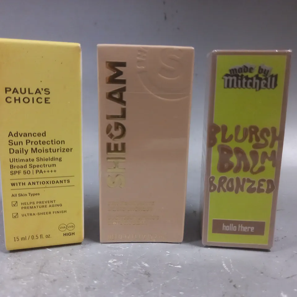 3 ASSORTED BEAUTY PRODUCTS TO INCLUDE PAULA'S CHOICE MOISTURIZER, SHEGLAM LIQUID BRONZER, MADE BY MITCHELL BLURSH BALM