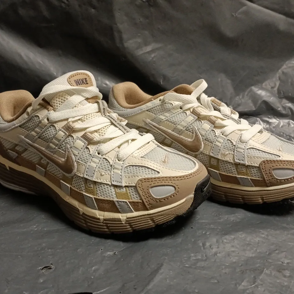 PAIR OF NIKE P-6000 TRAINERS IN TAN/BEIGE SIZE UK 4