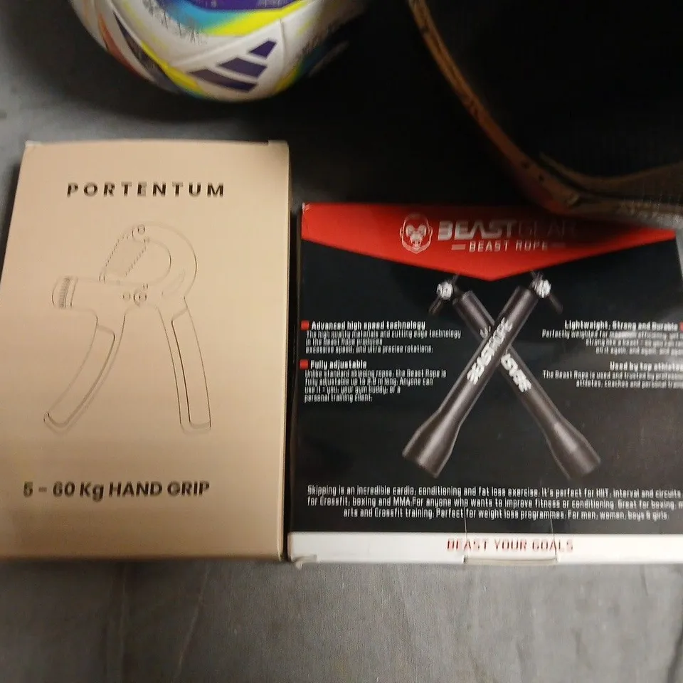 LOT OF 4 ASSORTED SPORTING ITEMS TO INCLUDE GRIP TRAINER AND FOOTBALLS