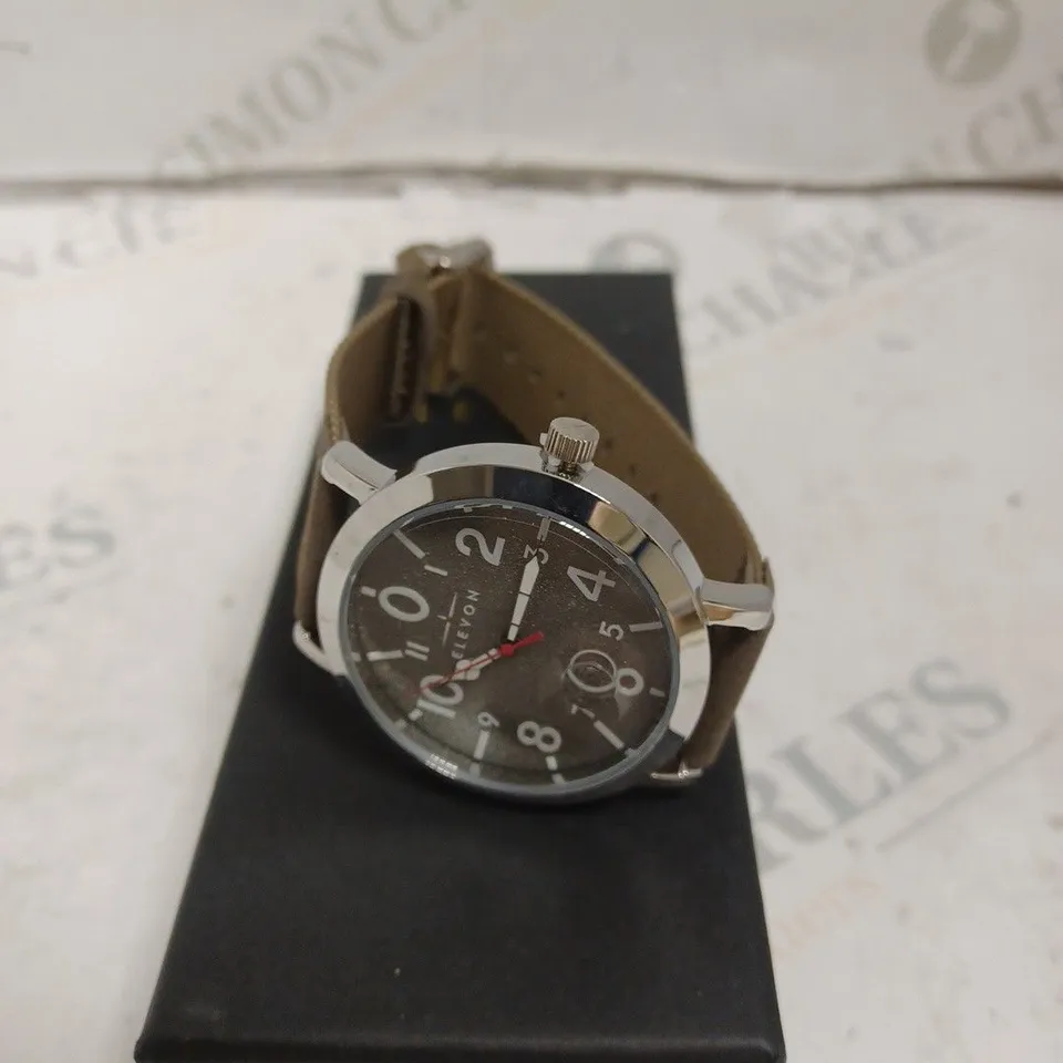 BOXED ELEVON WATCH - STAINLESS STEEL CASE BACK - JAPAN QUARTZ MOVEMENT - WATER RESISTANT 5 ATM - MAGNIFIED DATE. 