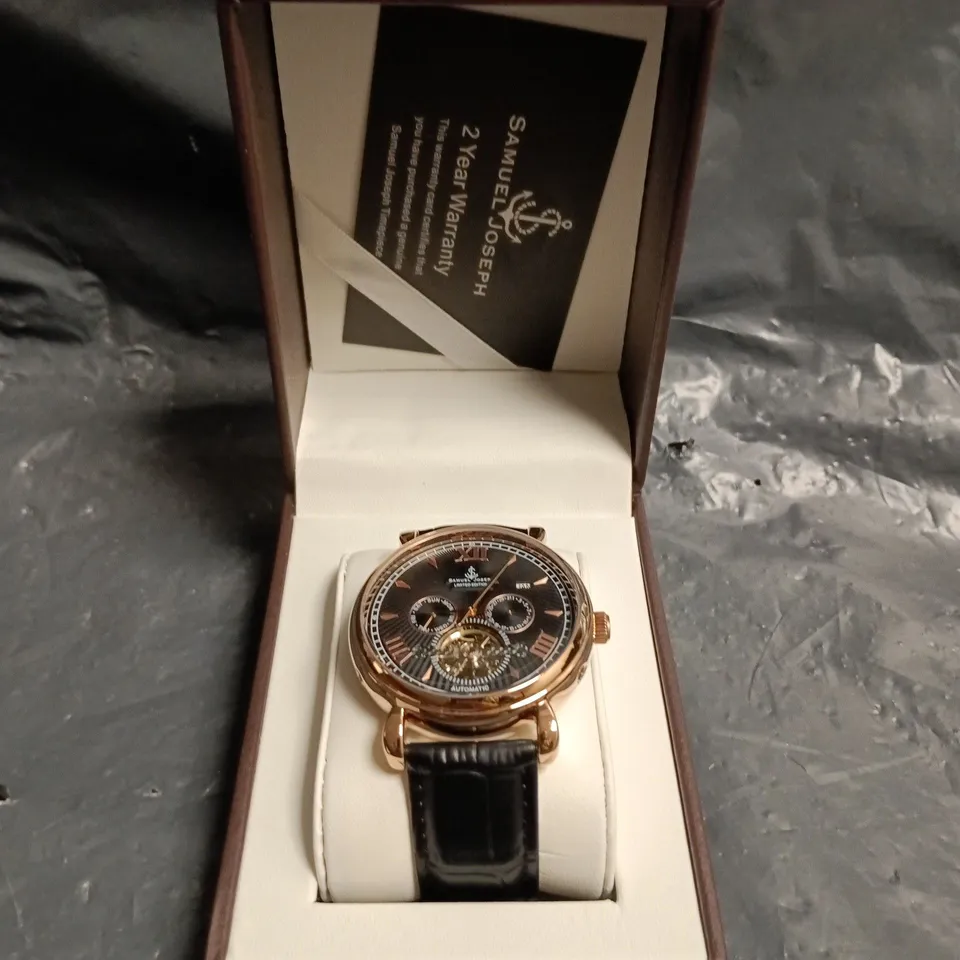 SAMUEL JOSEPH AUTOMATIC WRISTWATCH WITH BLACK DIAL AND SKELETON MOVEMENT