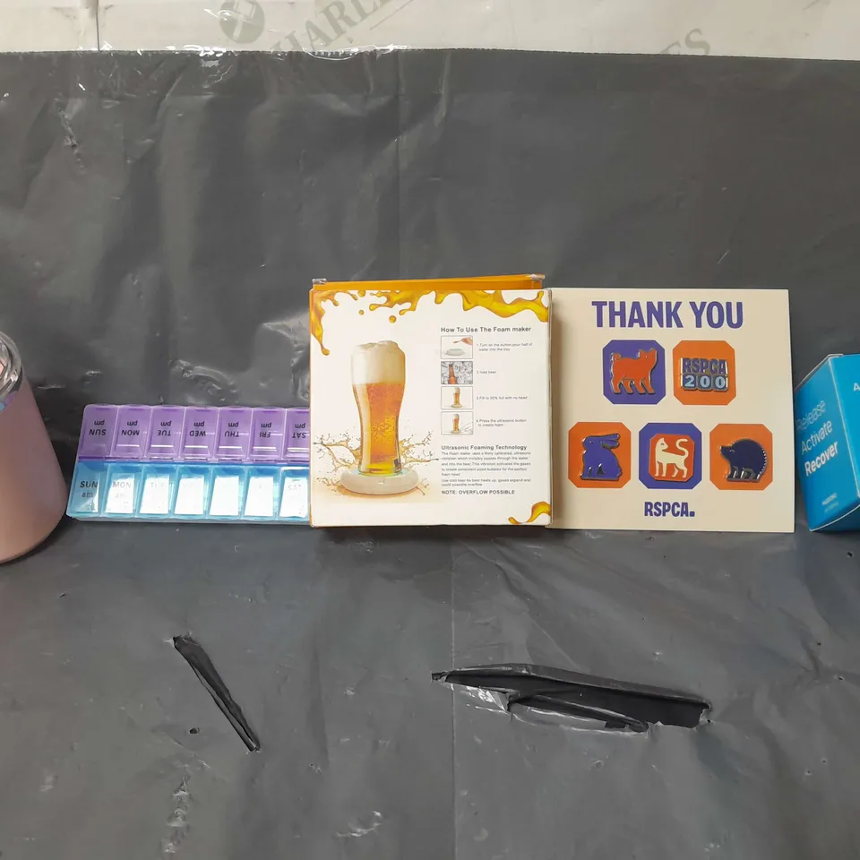 BOX OF APPROXIMATELY 14 ASSORTED ITEMS TO INCLUDE - RSPCA BADGE , NABOSO ACTIVATE YOUR FEET , FOAM MAKER ETC