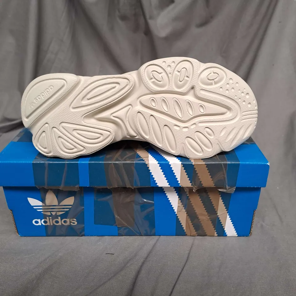 BOXED PAIR OF ADIDAS OZWEEGO TRAINERS IN VINTAGE WHITE SIZE 2