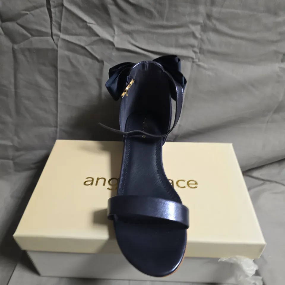 BOXED PAIR OF ANGLES FACE TEEN SANDALS - UK SIZE 36