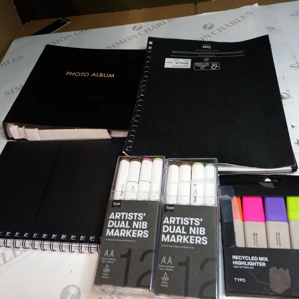 MEDIUM BOX OF ASSORTED NOTE BOOKS , SHARPIES AND PHOTO ALBUM