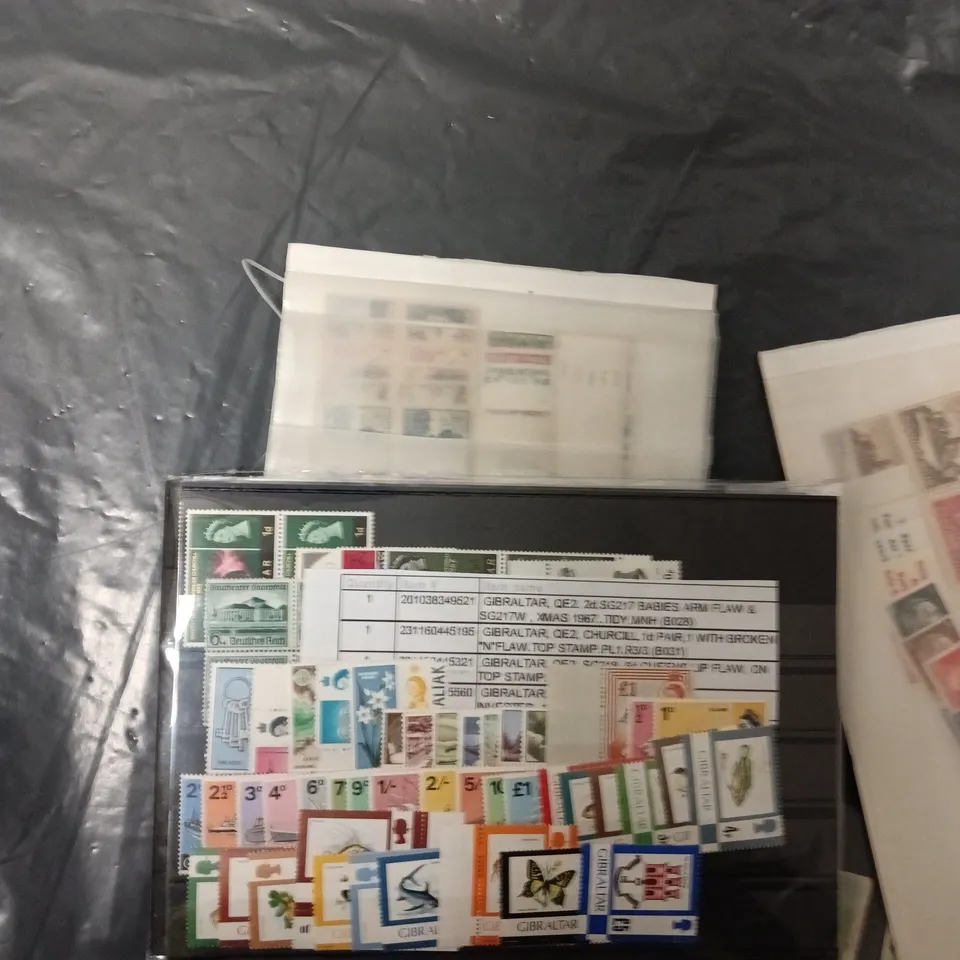 BOX OF APPROXIMATELY 50 ASSORTED STAMPS