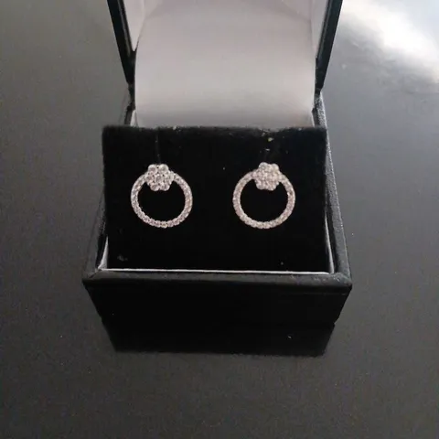 DIAMONIQUE FLOWER STUDDED CIRCLE EARRINGS RHODIUM PLATED