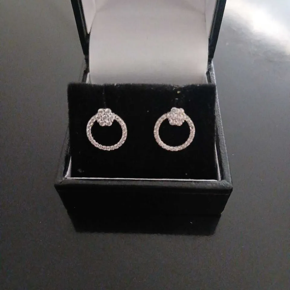 DIAMONIQUE FLOWER STUDDED CIRCLE EARRINGS RHODIUM PLATED