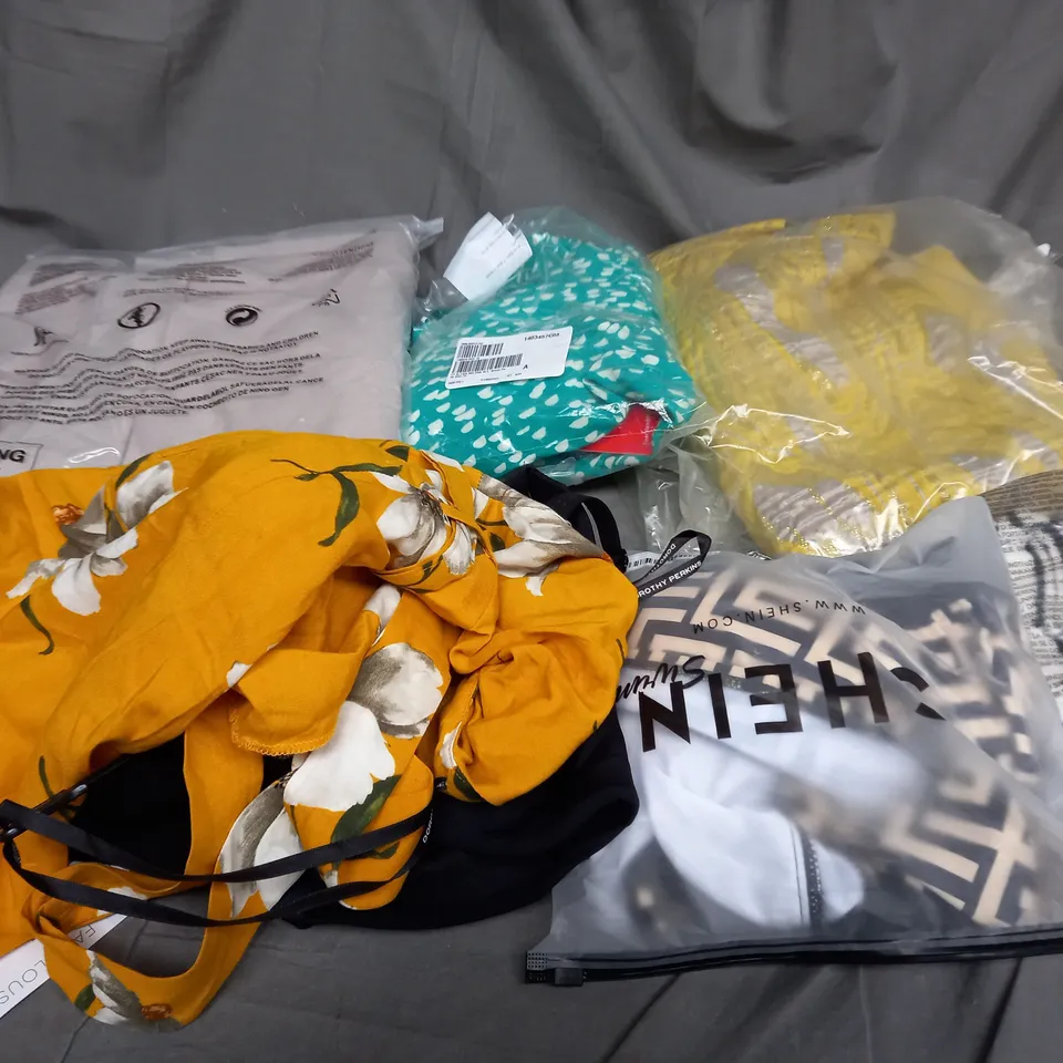 LARGE QAUNTIITY OF ASSORTED CLOTHES IN VARIOUS COLORS AND SIZES TO INCUDED DRESSES, T-SHIRTS AND TROUSERS