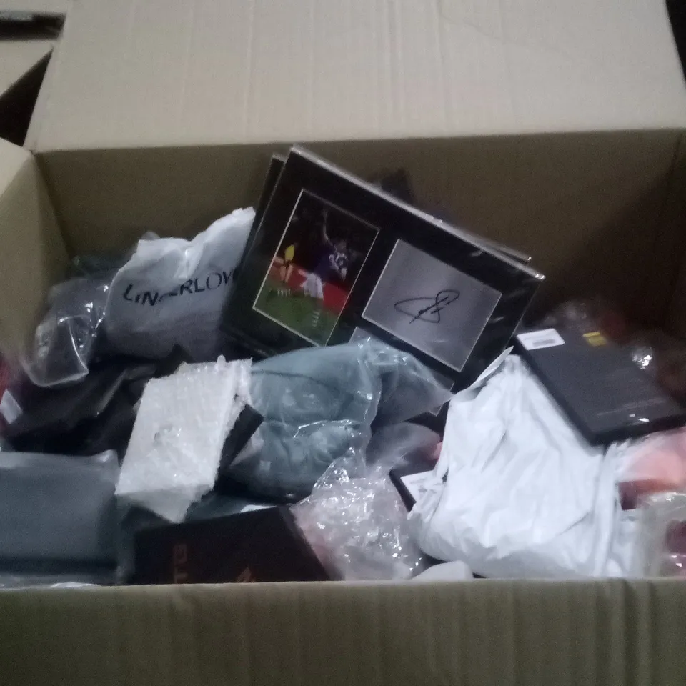 PALLET OF ASSORTED ITEMS INCLUDING PHONE CASES , CLOTHING , SIGNED MEMORABILIA , ETC  