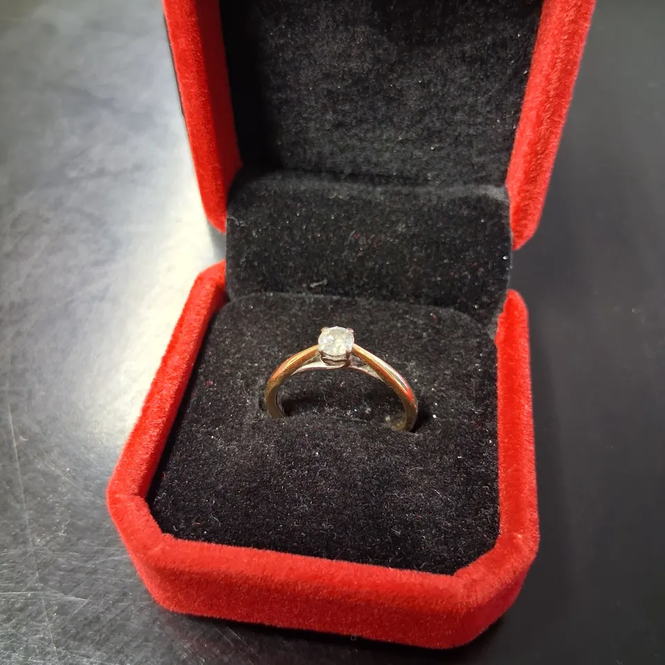 9CT GOLD SOLITAIRE RING SET WITH A NATURAL DIAMOND