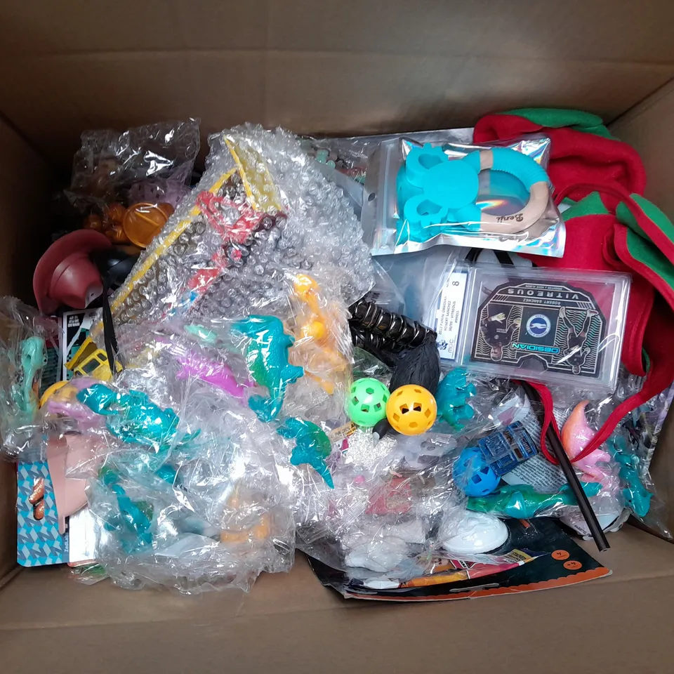 MEDIUM BOX OF ASSORTED TOYS AND GAMES TO INCLUDE STRESS BALL, TRIVIA GAME AND CARD TRAINING GAMES