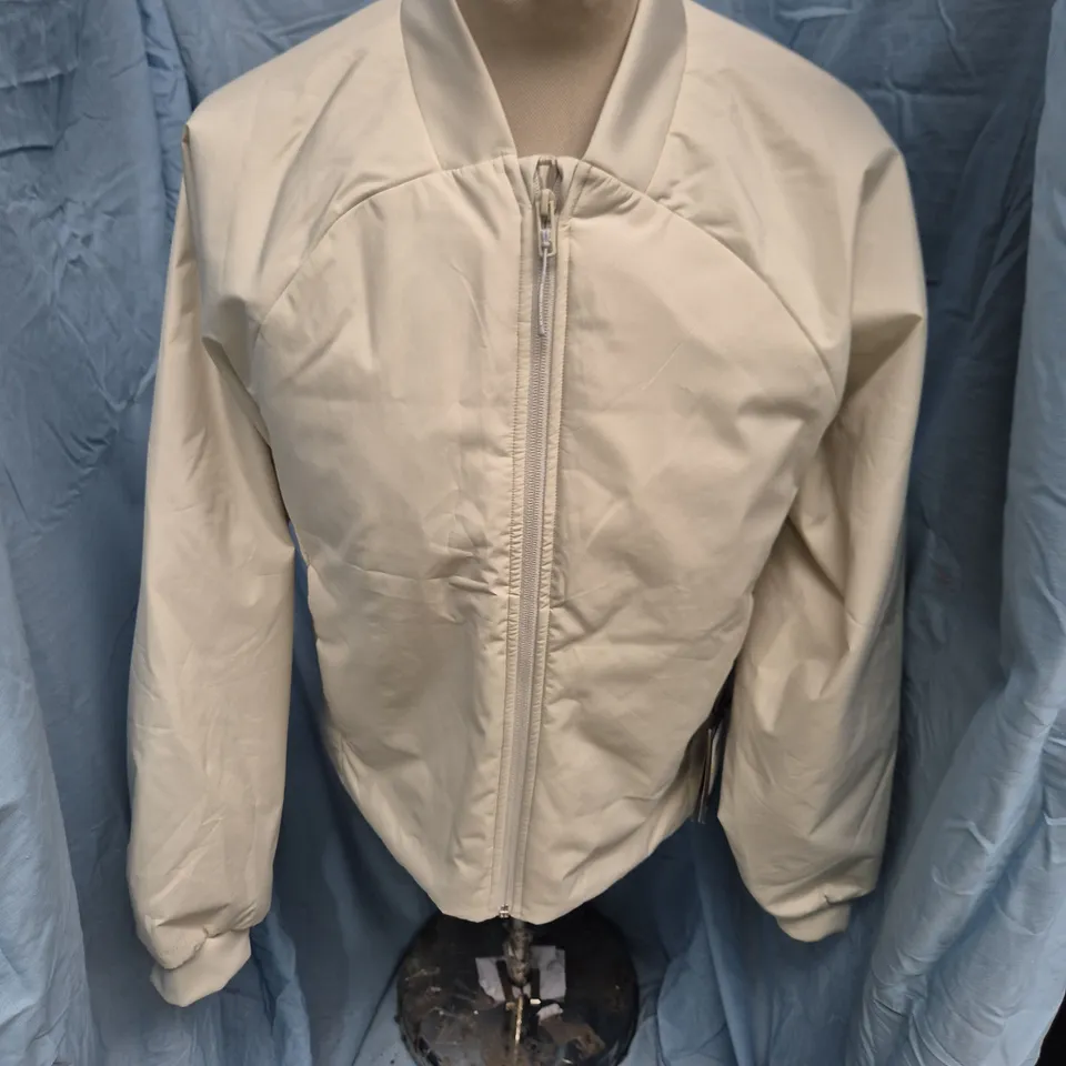 UNDER ARMOUR WOMEN'S UNSTOPPABLE INSULATED BOMBER JACKET – BEIGE