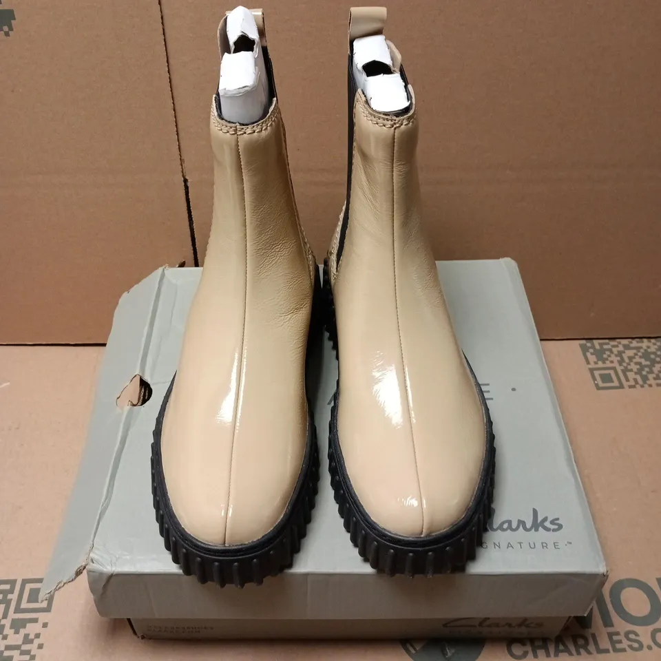 BOXED PAIR OF CLARKS TORHILL MAPLE BOOTS IN BEIGE PATENT - UK 4.5