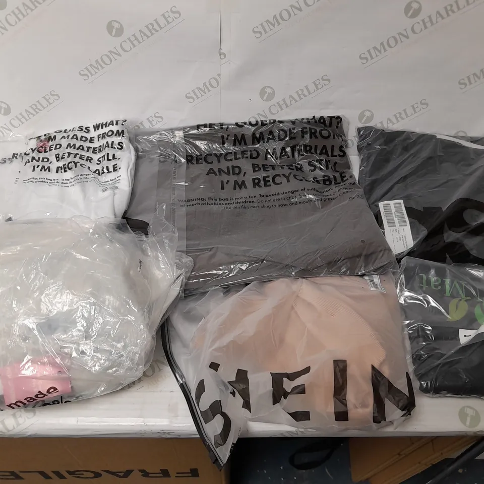 LARGE BOX OF ASSORTED CLOTHING ITEMS IN VARIOUS COLOURS AND SIZES INCLUDING TROUSERS , TOPS AND JUMPERS