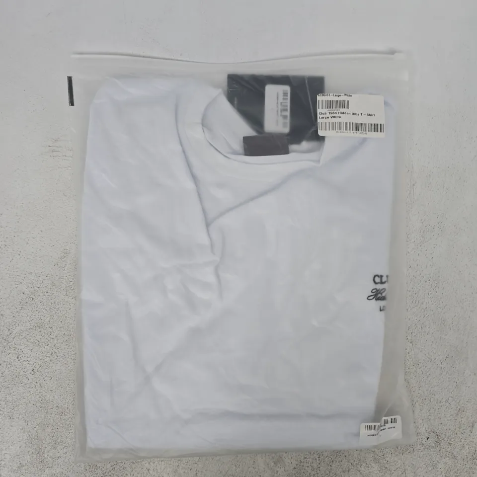 BAGGED CLUB 1984 HIDDEN HILLS T-SHIRT IN WHITE SIZE LARGE