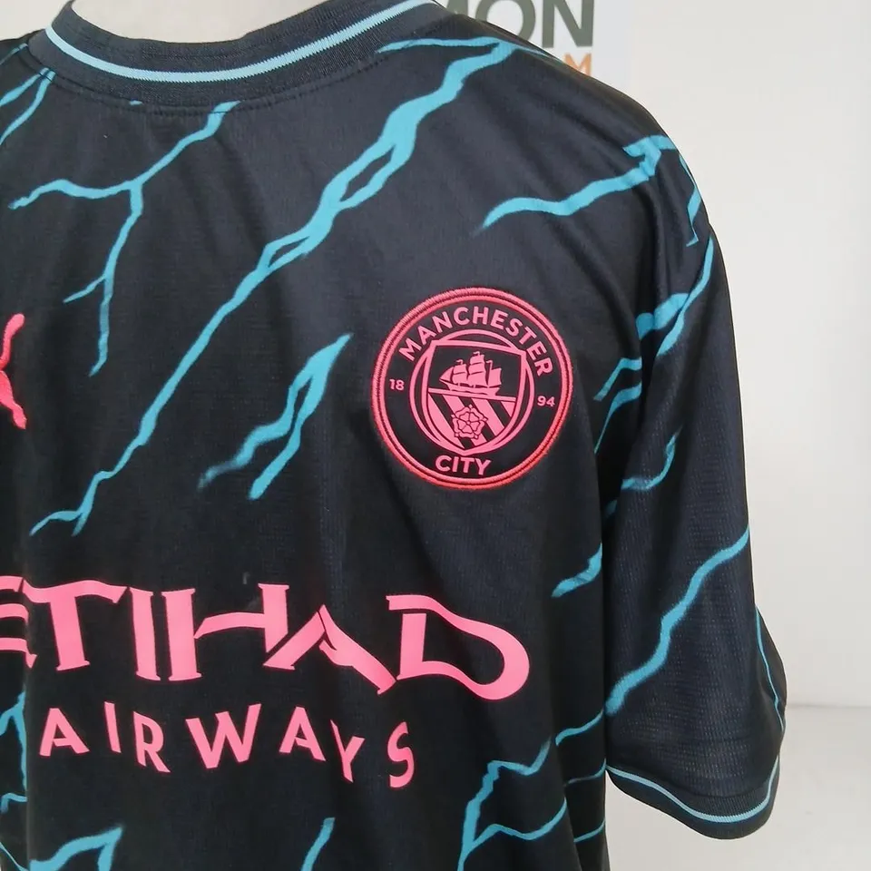 PUMA MANCHESTER CITY FOOTBALL SHIRT – 2023/24 THIRD KIT, BLACK WITH TURQUOISE BOLT PATTERN