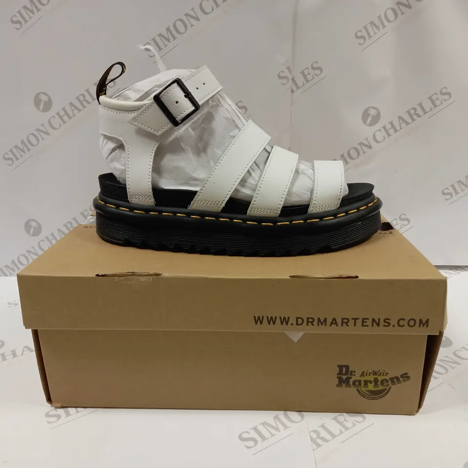 boxed pair of dr martens blaire hydro leather strap sandals 