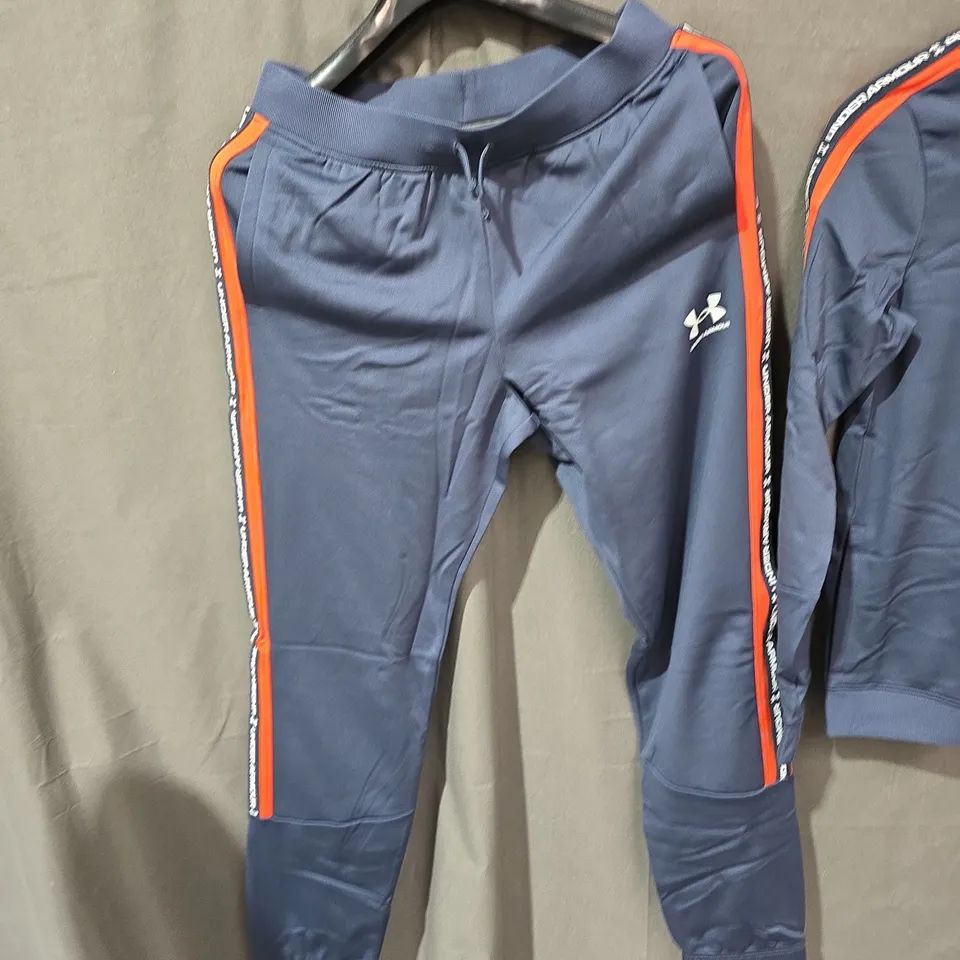 UNDER ARMOUR TRACKSUIT JACKET & JOGGERS – NAVY WITH ORANGE STRIPES