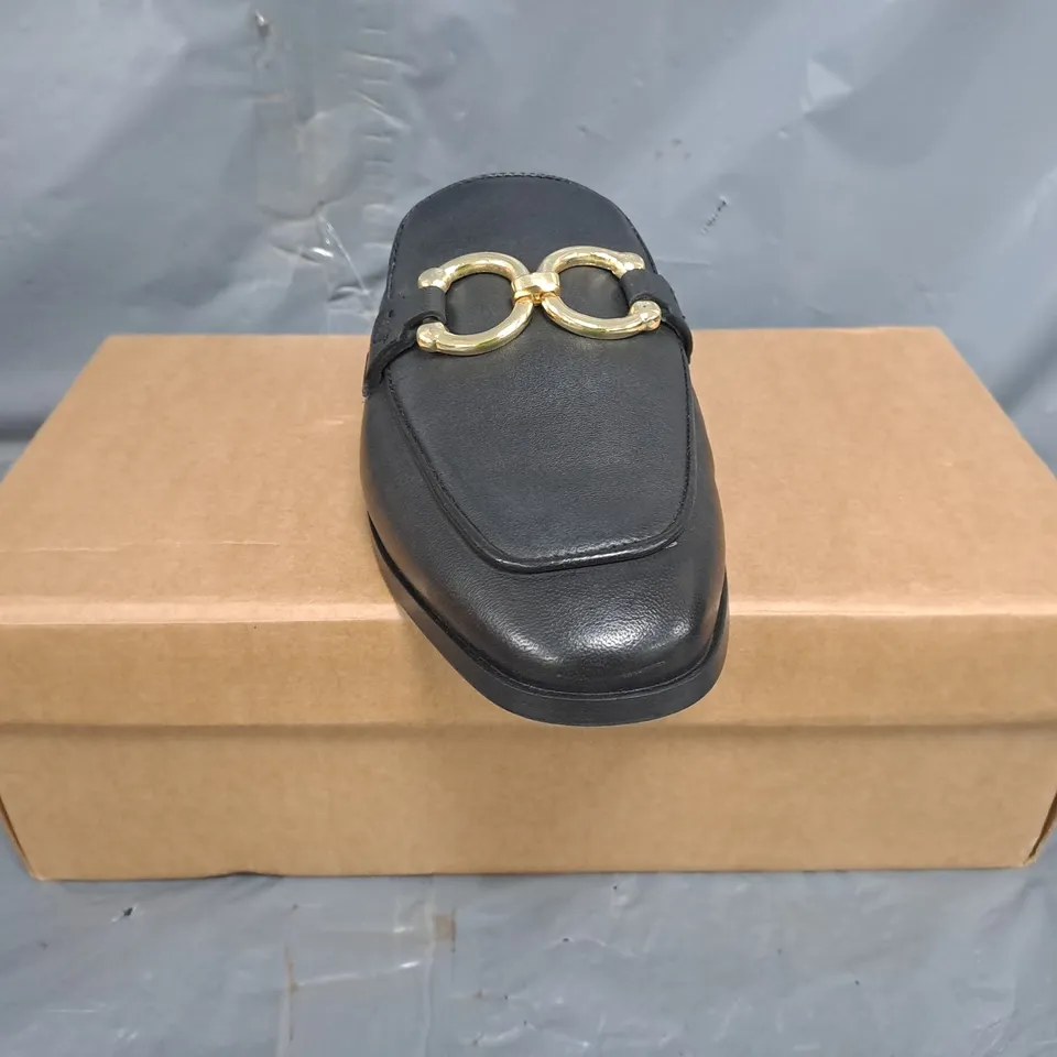 BOXED PAIR OF KAREN MILLEN OPEN BACK ELIP-ON LOAFERS IN BLACK W. GOLD EFFECT DETAIL SIZE 7