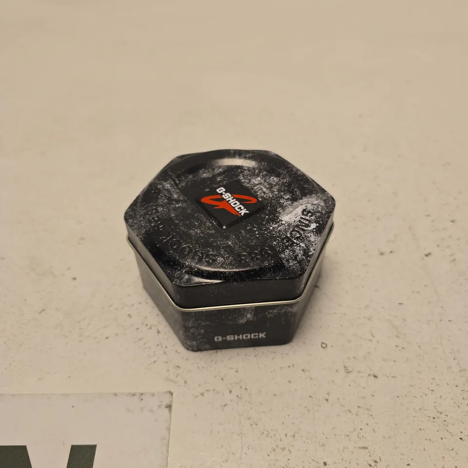 CASIO G-SHOCK DIGITAL WATCH WITH HEXAGONAL TIN BOX