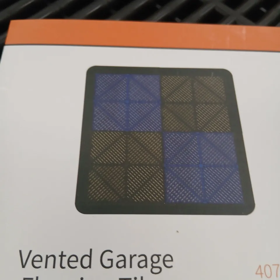 APPROXIMATELY 300 VENTED GARAGE FLOORING TILES