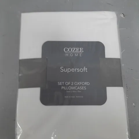 TWO WHITE COZEE HOME PILLOWCASES