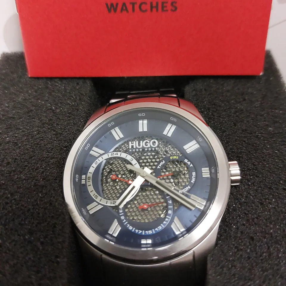 BOXED HUGO BOSS HUGO SKELETON BLUE DIAL WRIST WATCH