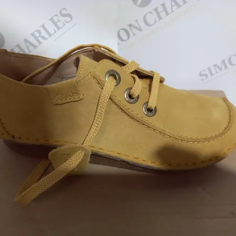 BOXED PAIR OF CLARKS FUNNY DREAM YELLOW SUEDE IN SIZE 6