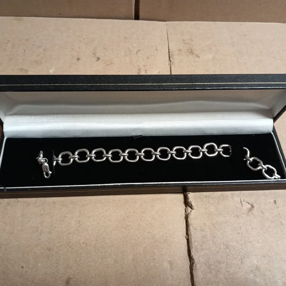 SILVER-TONE BRACELET WITH LARGE CIRCULAR LINKS IN PRESENTATION BOX