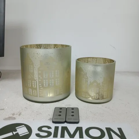 SET OF 2 FROSTED GLASS LIGHT HOLDERS WITH CITYSCAPE SILHOUETTES β GOLD INTERIOR