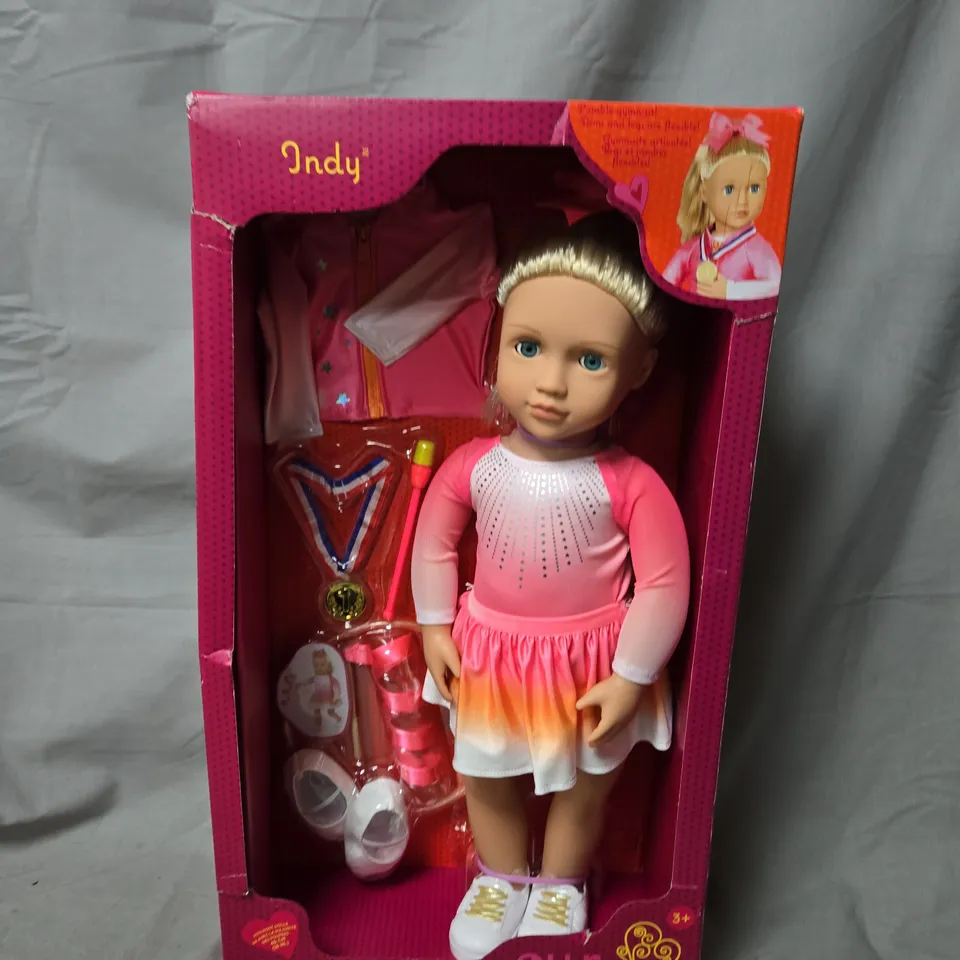 OUR GENERATION INDY DOLL – PINK DRESS WITH ACCESSORIES